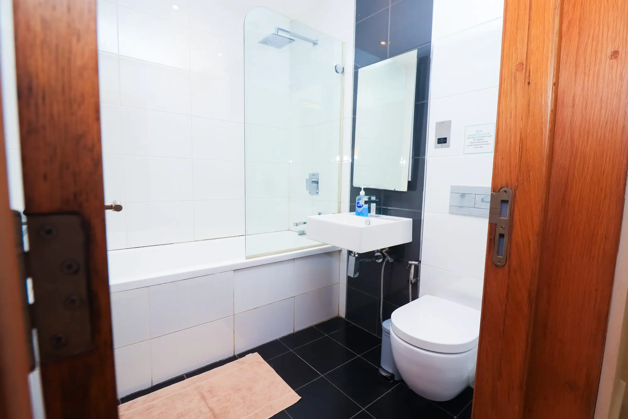 Family bathroom with bathtub and shower at Nyali Marina Stays holiday apartment, Nyali