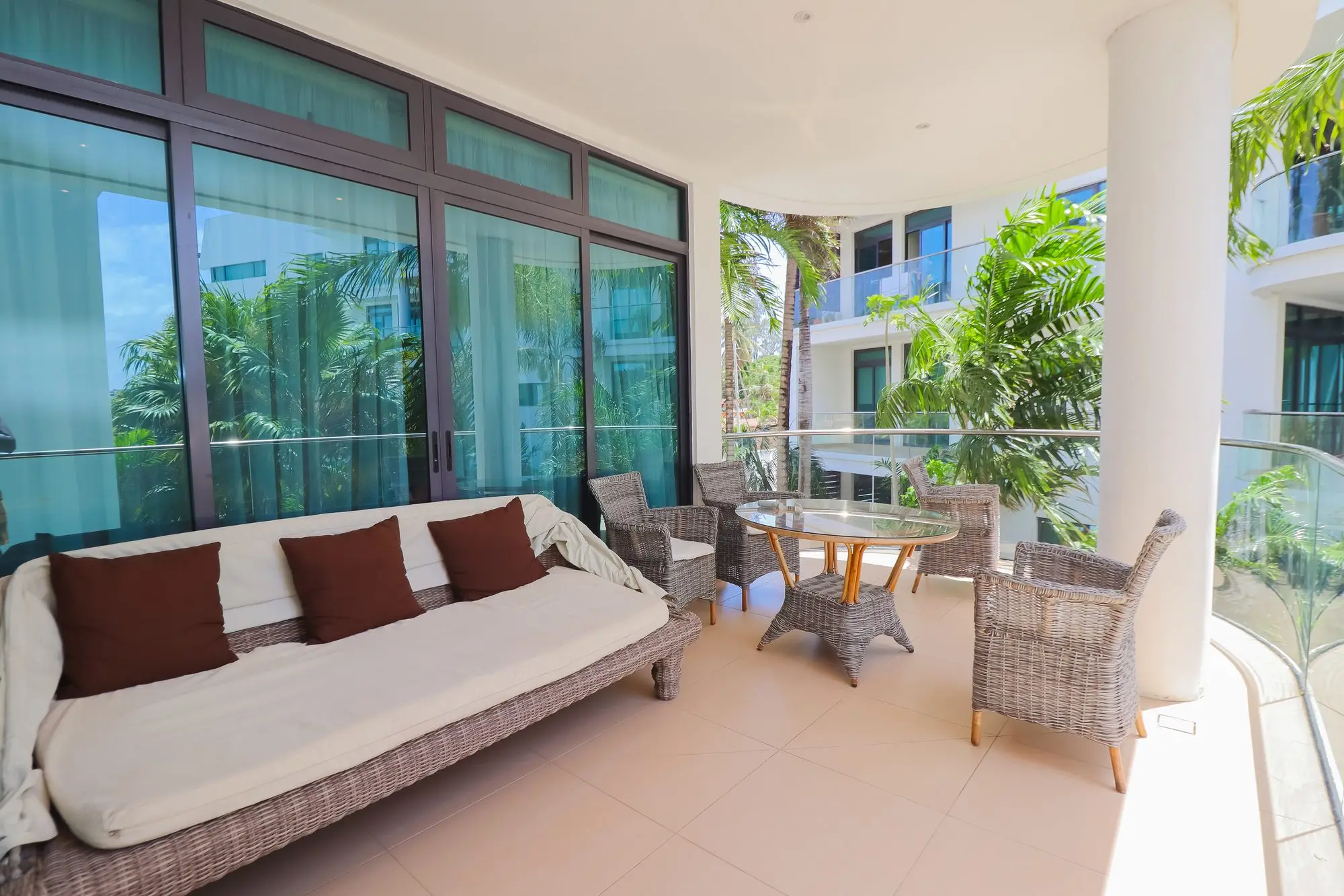 Private balcony with wicker daybed and seating at Nyali Marina Stays, Nyali Mombasa